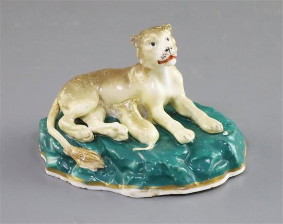 A Staffordshire porcelain group of a lioness and cub, c.1830-45, L. 10cm